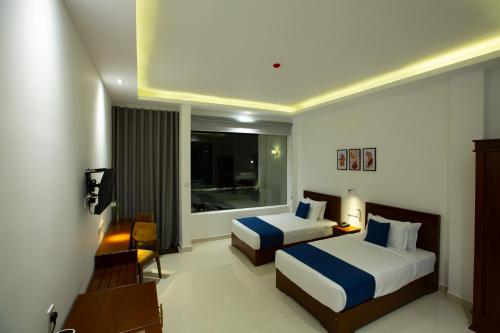 Postel nebo postele na pokoji v ubytování Heaven Breeze Hotel Ella