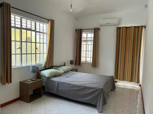 Кровать или кровати в номере Sun Palm Villa - Blue Bay