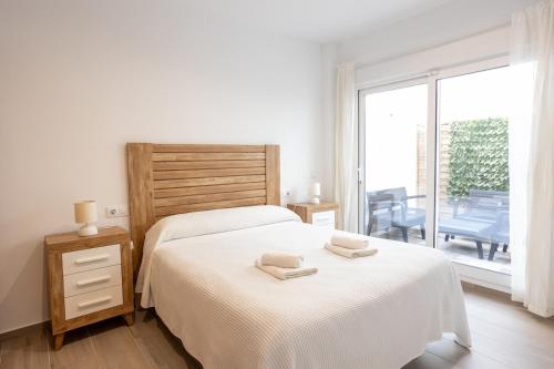 Postel nebo postele na pokoji v ubytování María Luisa Gran Sol Beach