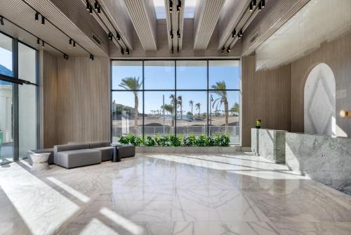 an office lobby with a large glass wall at Flow Spectrum Resort Sahl Hasheesh in Hurghada