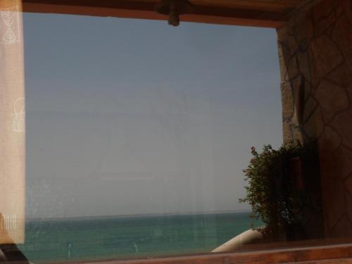 a window with a view of the ocean at Dar Rio Oro in Dakhla