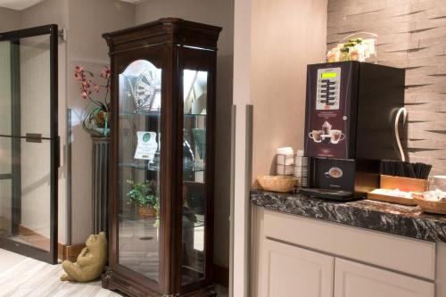 a kitchen with a counter with a coffee maker at Greenstay Hotel & Suites Central in Springfield