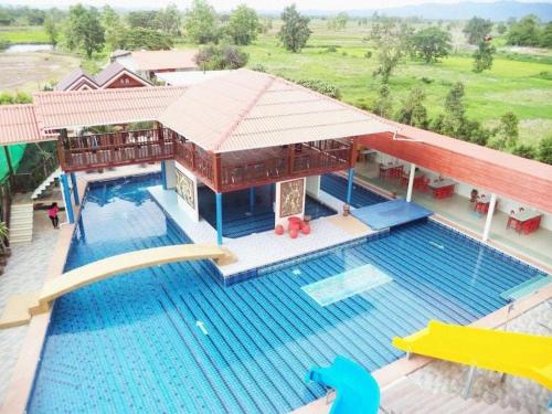 an aerial view of a house with a swimming pool at VC Phayao Hotel in Ban Dok Kham Tai (1)