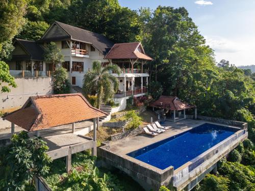 an aerial view of a house with a swimming pool at Villa Moon Talay View in Patong Beach