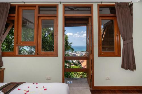 En eller flere senge i et værelse på Villa Moon Talay View