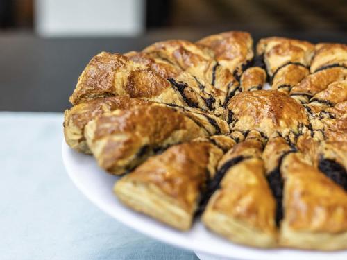 a pile of pastries on a plate on a table at Ibis Lagos Ikeja in Ikeja