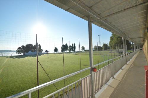 a view of a baseball field through a fence at Hotel Bodensee-Arena in Kreuzlingen
