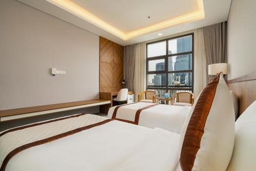 En eller flere senge i et værelse på Ben Thanh One Step Prime