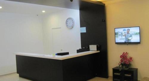 TV a/nebo společenská místnost v ubytování One Home Hotel