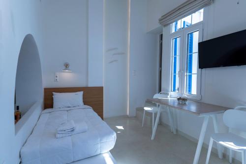 Una cama o camas en una habitación de Andromeda Residence