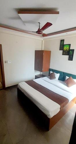 a bedroom with two beds in a room at HOTEL RAJBHOG indore in Indore