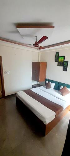 a bedroom with two beds in a room at HOTEL RAJBHOG indore in Indore