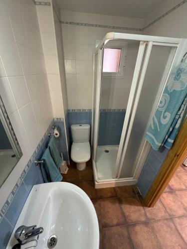 a bathroom with a shower and a sink and a toilet at Vivienda Chorrillos del Lavadero in La Iruela