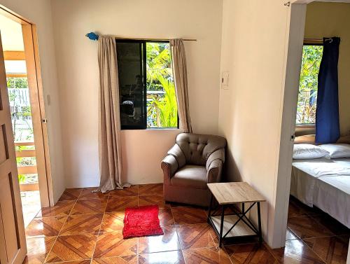 En eller flere senge i et værelse på Yellow House Port Barton