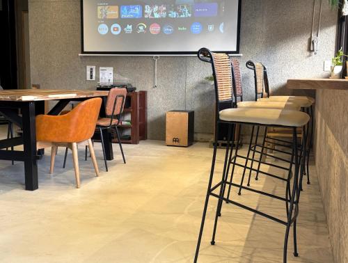 a group of chairs and tables in a restaurant at 富士Base御殿場 Station-Side in Gotemba