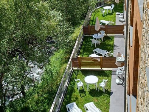 an overhead view of a balcony with a table and chairs at ApartHotel RIALB in El Serrat