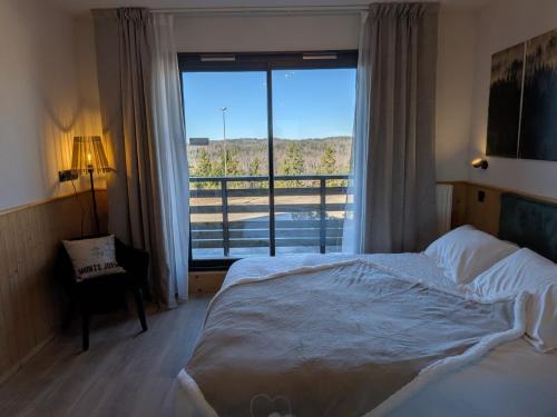 Postel nebo postele na pokoji v ubytování Juracîmes Appartements