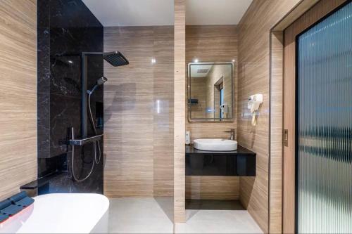 a bathroom with a toilet and a sink and a shower at Tonnam pool villa in Nong Prue