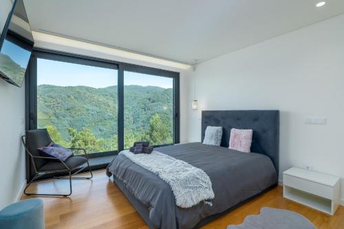 Ένα ή περισσότερα κρεβάτια σε δωμάτιο στο Gerês Paradise