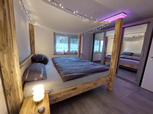 a bedroom with two bunk beds in a house at Fewo Erdgeschoss Ankerplatz mit Sauna direkt am Brombachsee bei Juliane und Klaus in Ramsberg