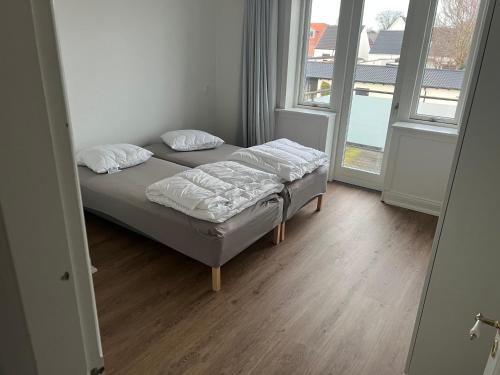 Postel nebo postele na pokoji v ubytování Midtbyperle