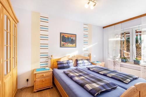 a bedroom with a large bed and a window at Ferienoase Balve in Balve