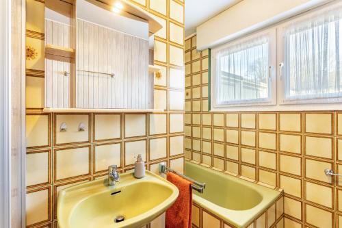 a bathroom with a sink and a mirror at Ferienoase Balve in Balve