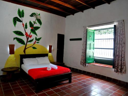 En eller flere senge i et værelse på La Hacienda San Antonio