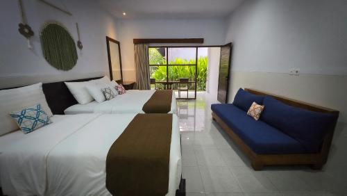 Postel nebo postele na pokoji v ubytování Maha di Nusa Lembongan