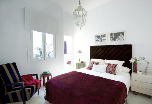 Posteľ alebo postele v izbe v ubytovaní Apartamentos Plaza Pilatos