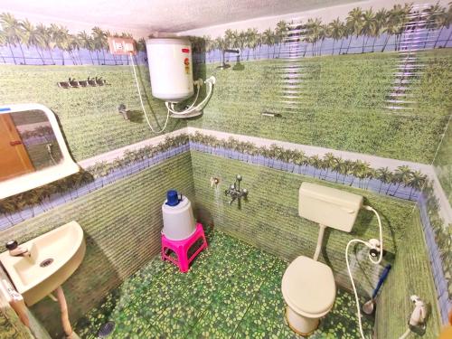 Ванная комната в Rising Surya Homestay