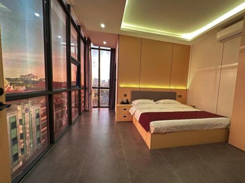 Postel nebo postele na pokoji v ubytování 游子酒店