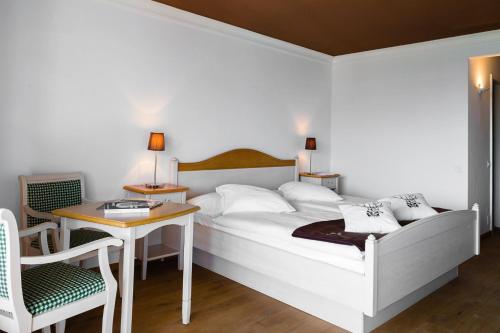 Postel nebo postele na pokoji v ubytování Hotel Etrier