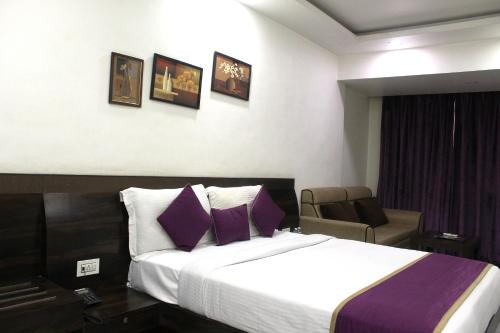 Ένα ή περισσότερα κρεβάτια σε δωμάτιο στο Hotel Planet Four