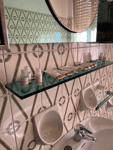 a bathroom with two sinks and a mirror at Rustic Apartment with AC in Bergamo