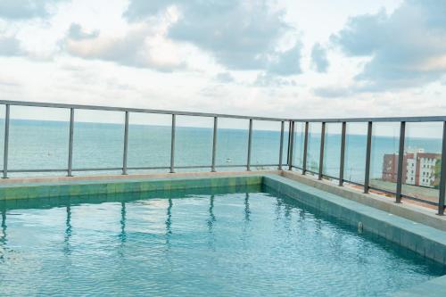 La alberca dentro o cerca de Sonne Flat Aurora - Frente Mar no Bessa