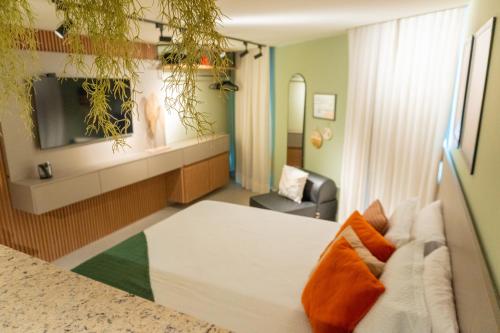 Una cama o camas en una habitación de Sonne Flat Aurora - Frente Mar no Bessa