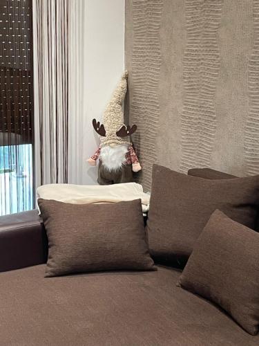 a room with a bed with a stuffed animal on the wall at Nice Wellness Apartman in Siófok