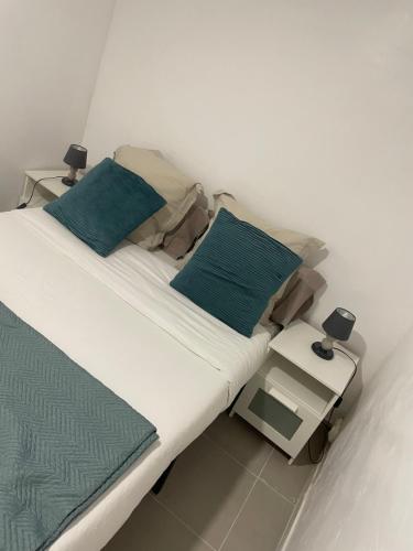 Giường trong phòng chung tại Appartement entier en cœur de ville