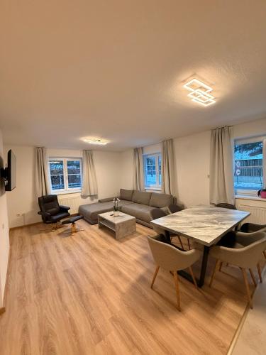 a living room with a couch and a table at Appartement Kodra in Sonnberg