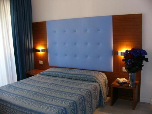 Postel nebo postele na pokoji v ubytování Hotel Serena