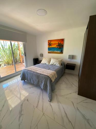 En eller flere senge i et værelse på Casa Nicole