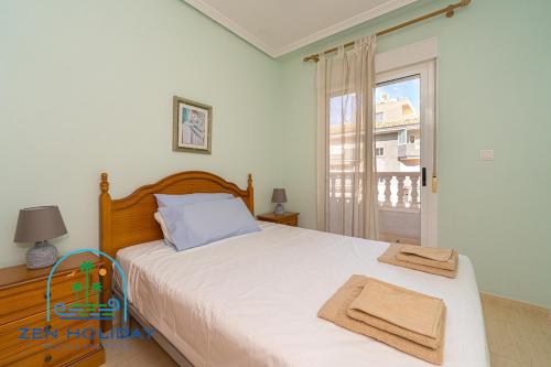 En eller flere senge i et værelse på 3 Bed 2 Bath Apartment Los Pinos