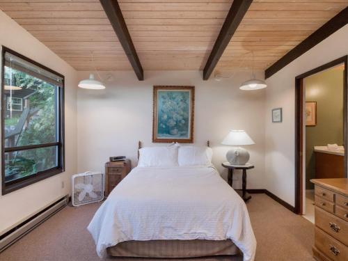 a bedroom with a large bed and a window at Friday Harbor Lights in Friday Harbor