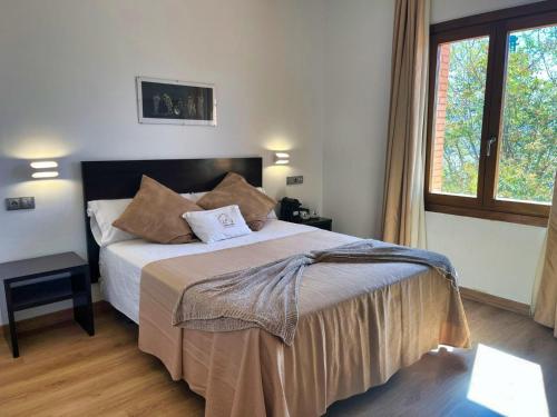 Ένα ή περισσότερα κρεβάτια σε δωμάτιο στο Hotel El Sueño de Jemik