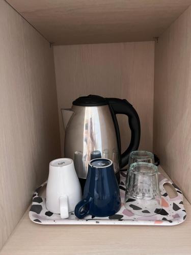 Příslušenství pro přípravu čaje a kávy v ubytování Summerville Homes