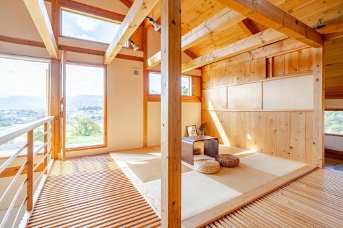 Ένα ή περισσότερα κρεβάτια σε δωμάτιο στο 北アルプス一望の家