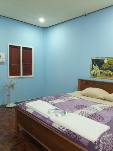 Llit o llits en una habitació de Anan guesthouse