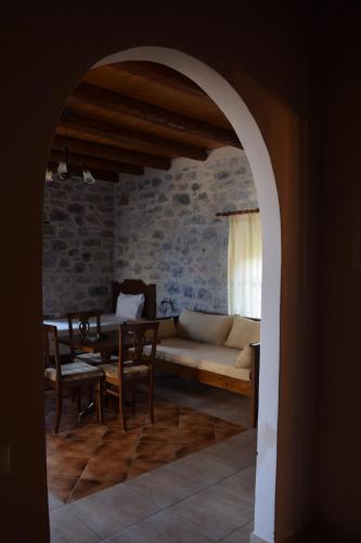 a living room with a couch and a table at Vasilios Apartments Hotel in Limeni