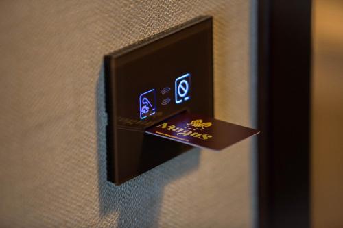 a close up of a switch on a wall at Magus Hotel in Baia Mare